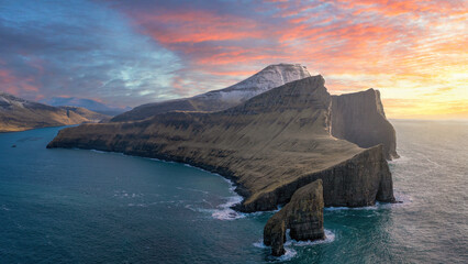 Drangarnir, Vágar, Faroe Islands. One of the most unique sights in the Faroe Islands are “Drangarnir”, which are two sea stacks between Vágar and the islet of Tindhólmur.  - obrazy, fototapety, plakaty