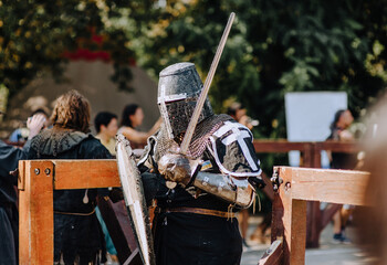 A strong knight, a Ukrainian from Ukraine warrior stands on the battlefield after defeating a...