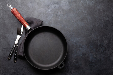 Empty frying pan and utensils