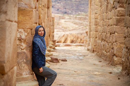 Attractive female tourist poses in Petra Jordan