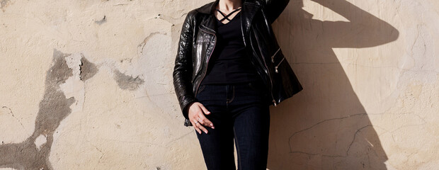 Fototapeta na wymiar woman wearing a black rock leather jacket