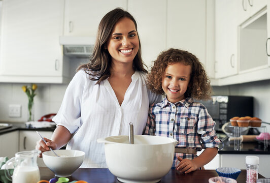 To What Do I Owe This Gift My Love. Portrait Of An Adorable Little Girl Baking With Her Mom At Home.