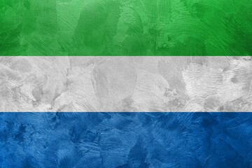 Textured photo of the flag of Sierra Leone.