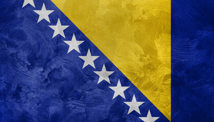 Textured photo of the flag of Bosnia and Herzegovina.