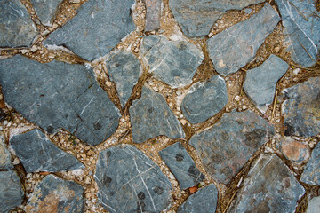 Texture of a stone wall. Old castle stone wall texture background. Stone wall as an abstract background or texture. Part of a stone wall, for background or texture