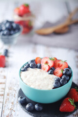 Milk rice with berries ready for breakfast