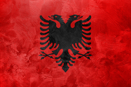 Textured photo of the flag of Albania. - Powered by Adobe