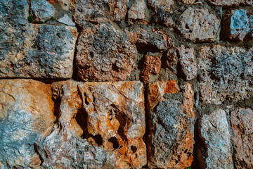 Texture of a stone wall. Old castle stone wall texture background. Stone wall as an abstract background or texture. Part of a stone wall, for background or texture