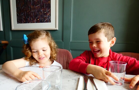 Girl and boy having a nice time at the restaurant in England