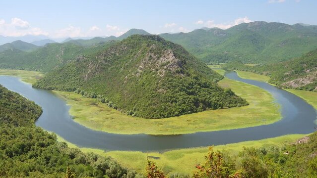 The charming valley of Rijeka Crnojevica on a sunny day. Filmed in UHD 4k video.