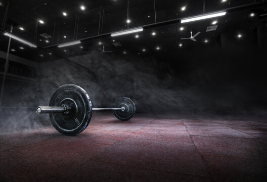 Barbell for fitness training in the gym. Sports background. 