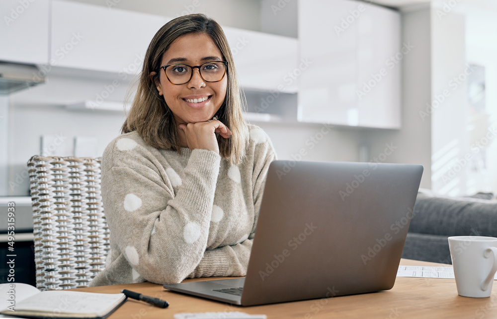 Poster working from home has been good to me. cropped shot of a woman using her laptop while working from h
