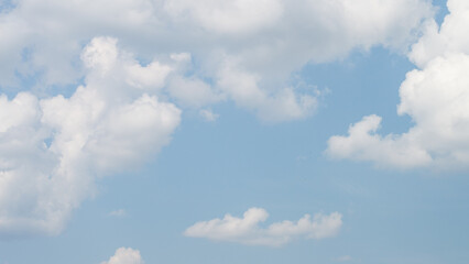 Blue sky with cumulous clouds. Summer skyscape