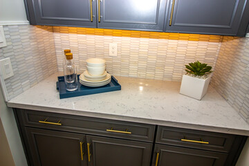 Kitchen Counter Top With Tray Of Dishes And Decanters