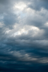 Stormy skies with dramatic clouds from approaching thunderstorms at sunset