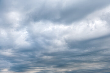 Stormy skies with dramatic clouds from approaching thunderstorms at sunset