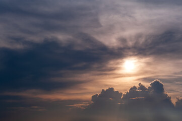 Stormy skies with dramatic clouds from approaching thunderstorms at sunset