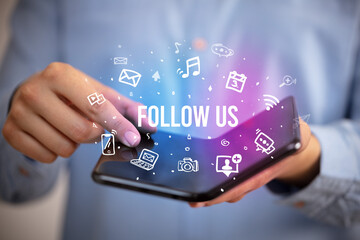 Businessman holding a foldable smartphone, social media concept