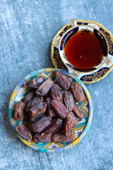 Red dates close up photo. Healthy sweets on a plate. Balanced diet concept. 