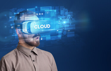 Businessman looking through Virtual Reality glasses