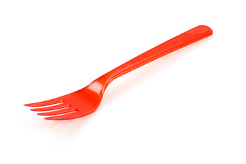 Disposable red plastic fork isolated on white background. Close-up. Full depth of field.
