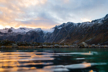 A beautiful hillside by the ocean in northern Norway, underwater foreground