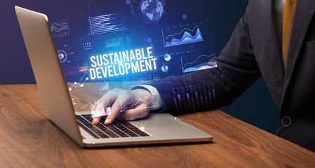 Businessman working on laptop, business concept