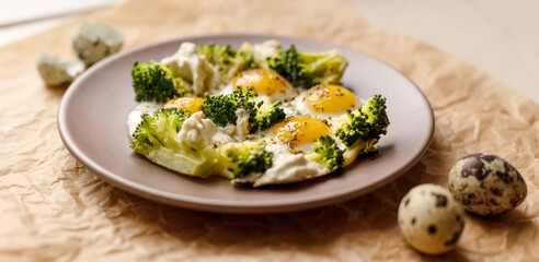 Breakfast with quail eggs, broccoli and cheese.