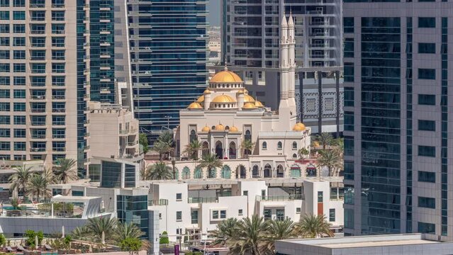 Dubai Marina skyline with Mohammad Bin Ahmed Al Mulla mosque aerial timelapse