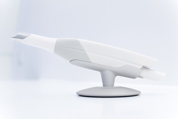 Dental intraoral scanner isolated on table in bright dentist office. Dentistry and health care concept. Close up.