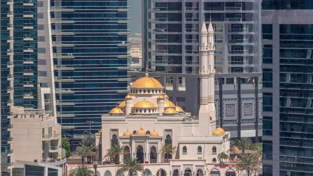 Dubai Marina skyline with Mohammad Bin Ahmed Al Mulla mosque aerial timelapse