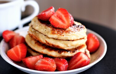 Closeup pancakes with strawberries food sweet breakfast dessert tasty pastry bakery red berry cup