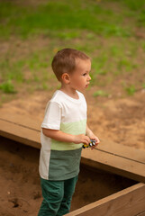 Cute little Caucasian boy playing in the playground