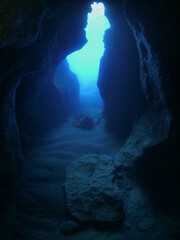 cave diving underwater scuba divers exploring caves and having fun ocean scenery sun beams and rays background