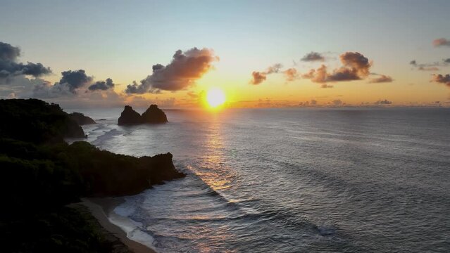 Sunset bay water archipelago of Fernando de Noronha at brazilian atlantic ocean Brazil. Sunset paradise islands at Fernando de Noronha archipelago. Sunset summer travel. Tropical destinations.  