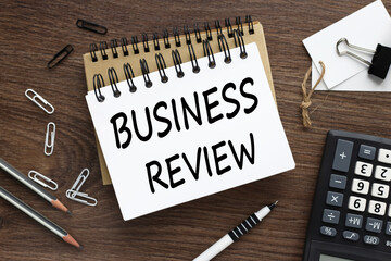 business review. two notebooks on the desktop text on the page