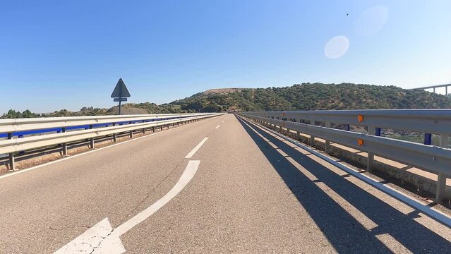 bridge over Tagus river at the N-630 km521 paved road at Embalse de Alc&aacute;ntara, province of C&aacute;ceres, Extremadura, Spain - dolly