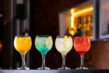 red, blue, white drink with ice classic cocktail glasses drink in the club caipirinha, negroni cold and in the glass. cocktails collection isolated on rustic background