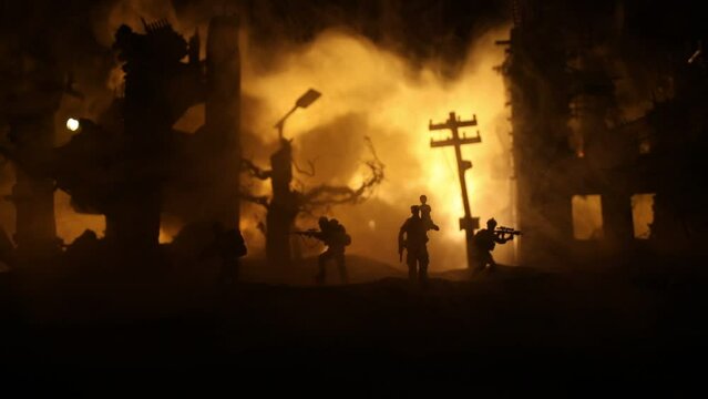 Silhouette soldier carrying little boy on his shoulder from fire. Russian war in Ukraine concept. Man moving out with little boy from burned out city destroyed in war. Selective focus