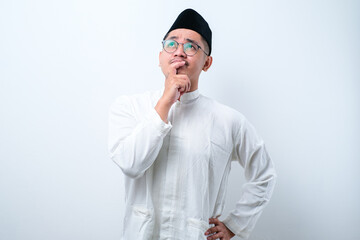 Asian muslim man doing thinking gestire, looking for idea
