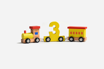 Very colorful toy wooden train with the number three. Birthday celebration love and happiness, performance illustration, online educational toy.Early learning