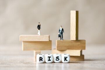 Risk business concept, business man stands on wooden blocks. risk control and managment idea