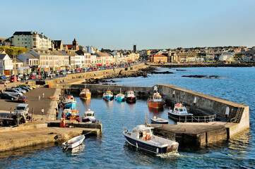 Portstewart fishing boat harbour and main street seafront, County Derry. 3 miles from Coleraine and Portrush, Northern Ireland. - obrazy, fototapety, plakaty