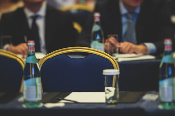 Audience at the conference hall listens to lecturer, people on a congress together listen to speaker on stage at master-class, corporate business seminar