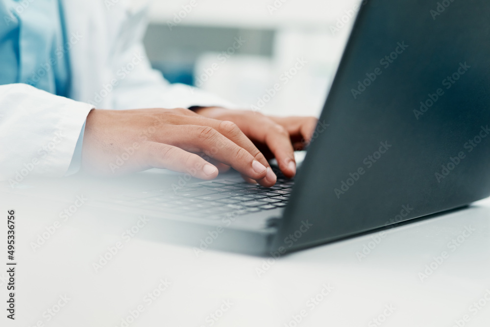 Poster Effective research to find an effective treatment. Cropped shot of a scientist using a laptop while working in a laboratory.