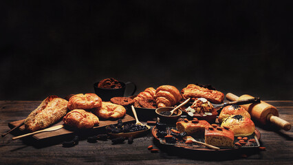 assortment of bread and bakery product arrangment on wooden table