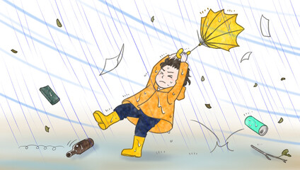 A boy almost blown over by the stormy wind