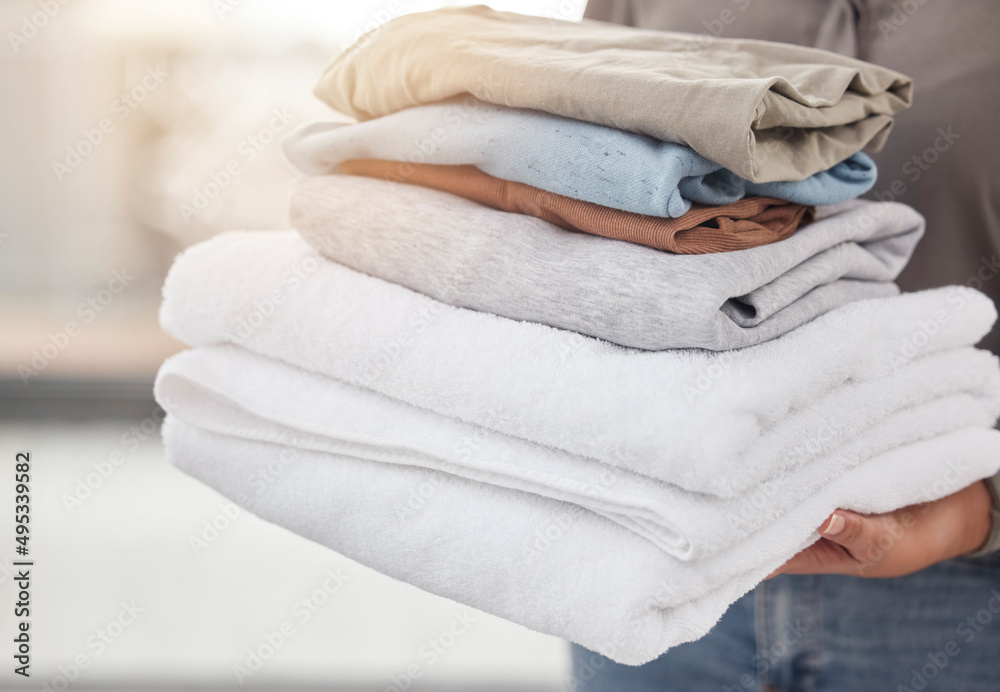 Canvas Prints Freshly cleaned. Shot of an unrecognizable person doing laundry at home.