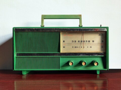 old transistor radio on wooden table
