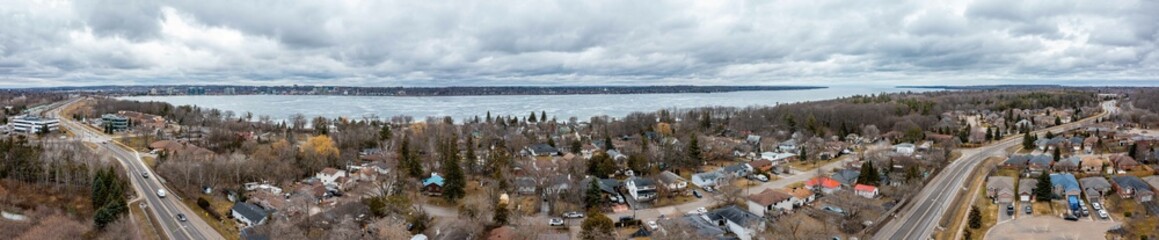 drone panorama Centennial Park in the spring time lake frozen cloudy sky 
